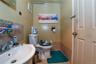 Bathroom with toilet and tile patterned flooring