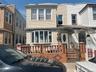 Townhome / multi-family property featuring a gate