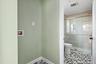 Bathroom featuring a shower stall and toilet