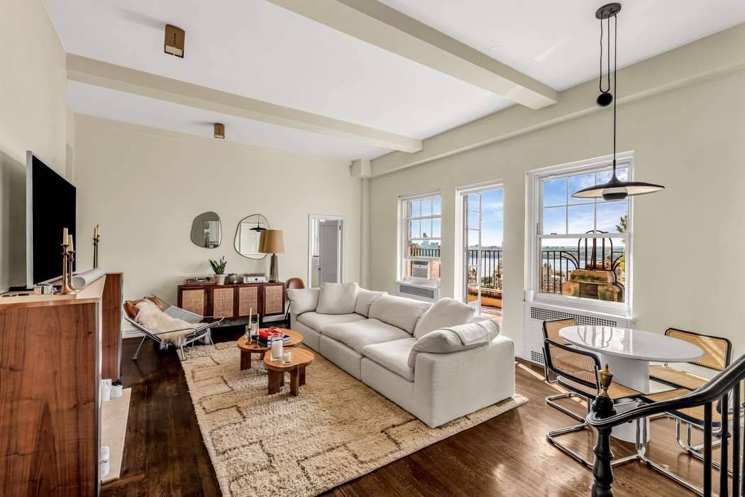 This captivating one of a kind penthouse features a private sixty foot terrace with panoramic views of the West Village and spectacular sunsets over the Hudson River.