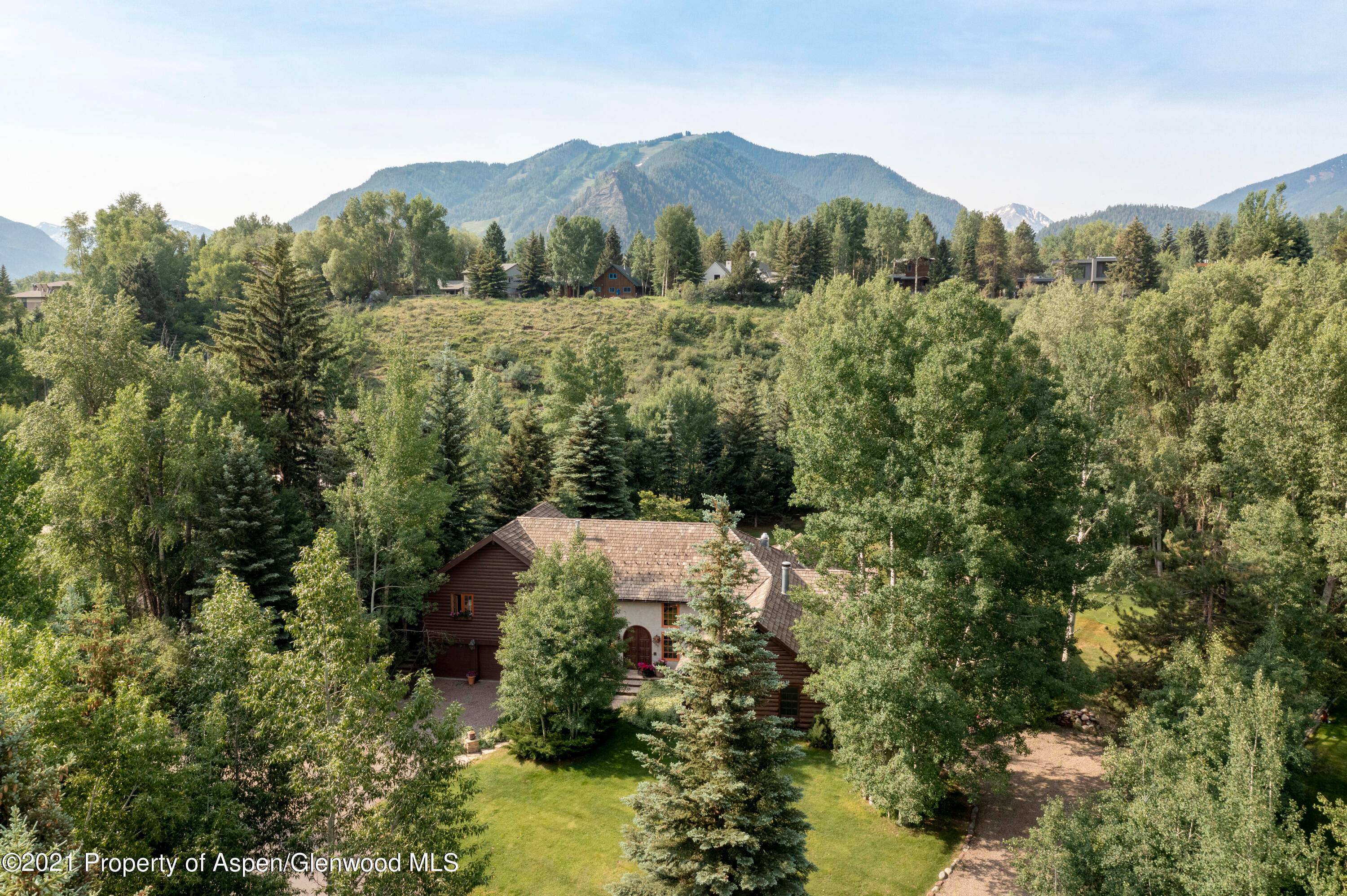 This unique Aspen home is located in West Aspen near the Roaring Fork River on Red Butte Drive.