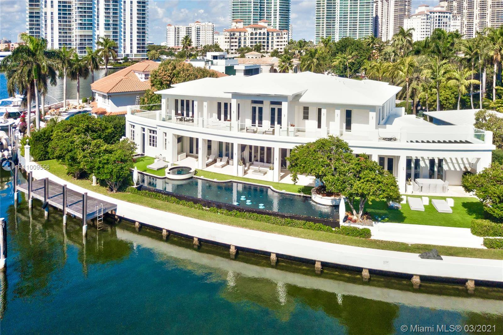 Set on an impressive 188ft of pristine water frontage, this impeccable estate home is truly one of a kind.
