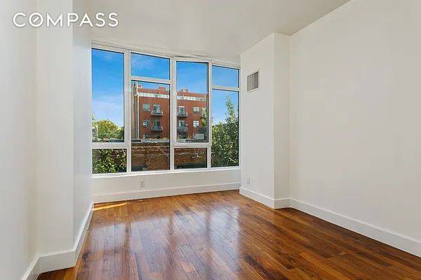 This oversized two bedroom, two bathroom condo is located in the heart of Williamsburg s.