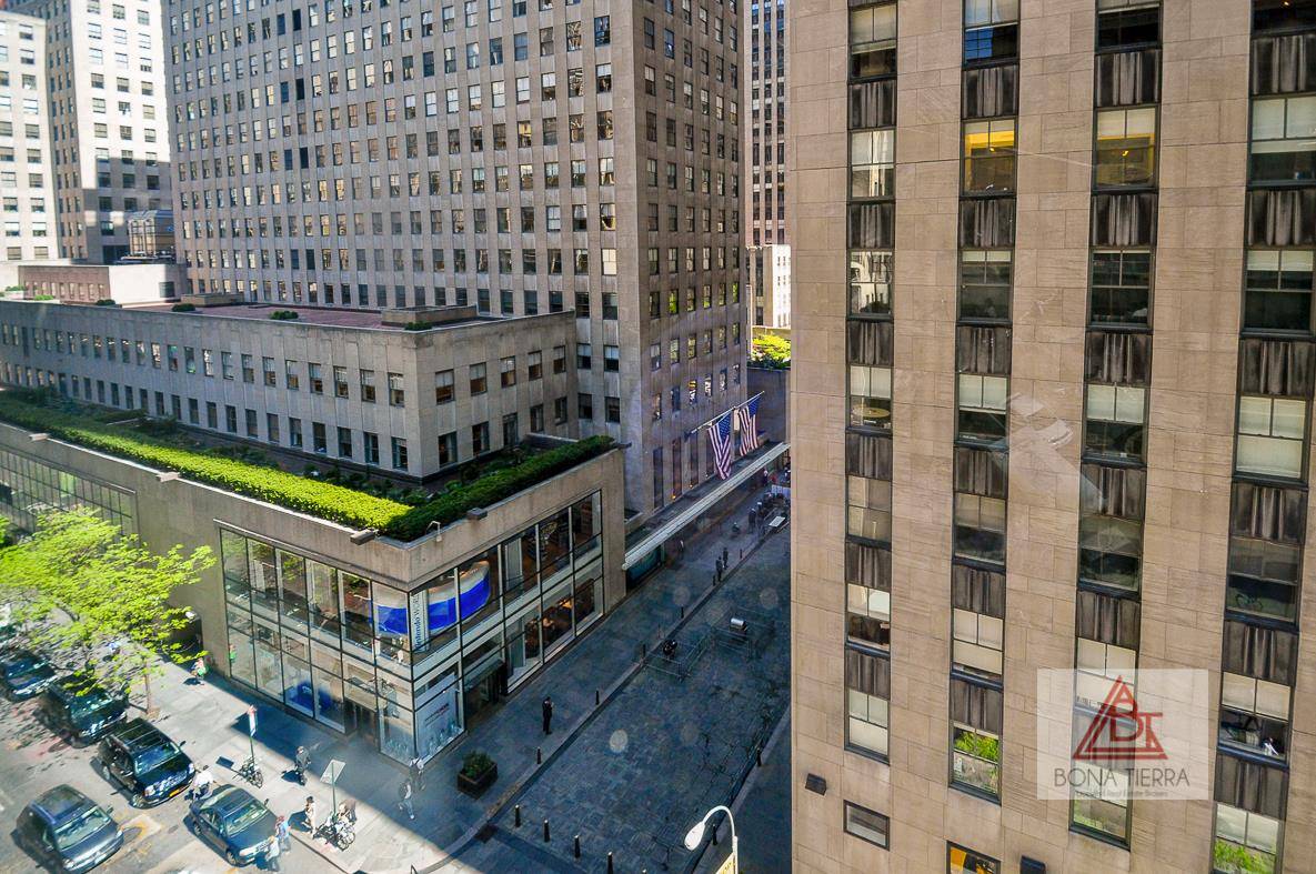 Modern Oversized Alcove Studio in Luxury Condominium with Direct Views of Rockefeller Center !