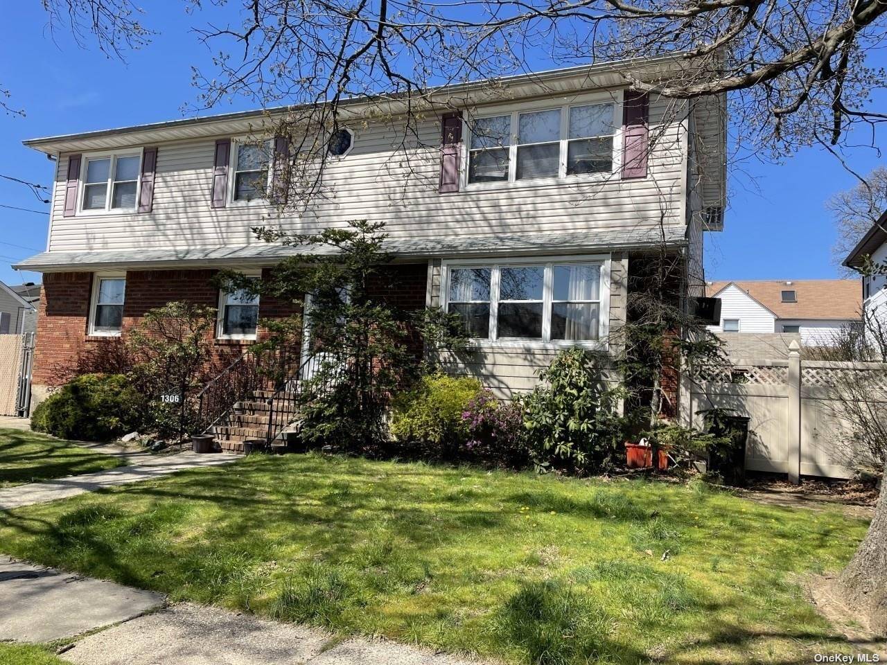 Spacious 13 room duplex colonial home with 4 bedrooms on first floor and 3 bedrooms on 2nd floor.