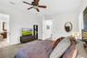 Spacious primary suite with en suite bathroom and walk-in closet
