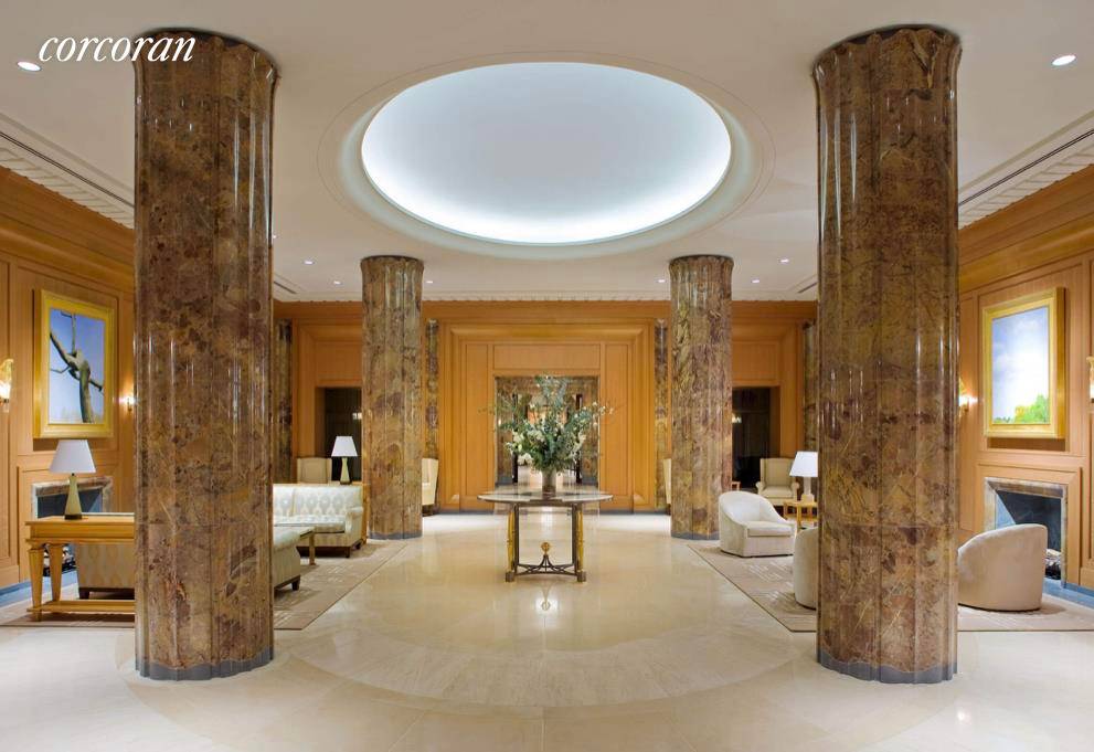 15 Central Park West has a magnificent oak paneled, limestone and marble lobby.