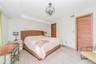 Bedroom with a closet, light wood-style flooring, and a chandelier