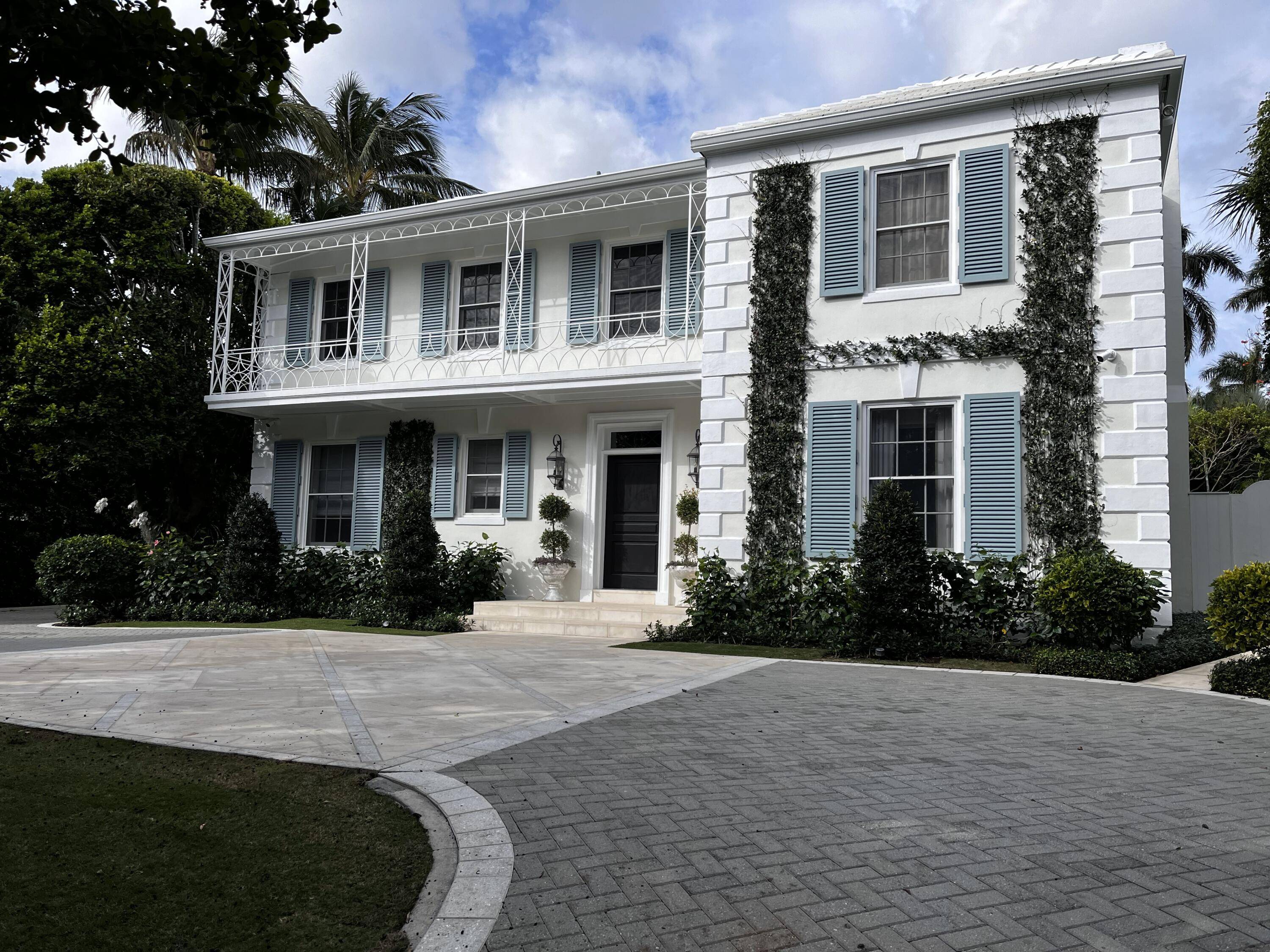 Gorgeously remodeled Monterey Colonial home designed by renowned Palm Beach architect John Volk.