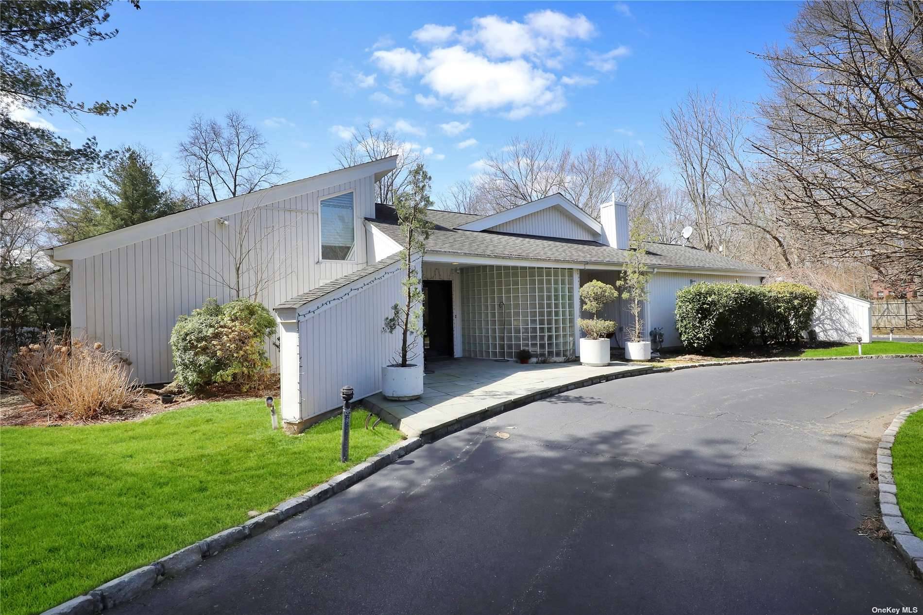 Welcome to this Mesmerizing Contemporary Home in Woodbury spread on 1 Acre land.