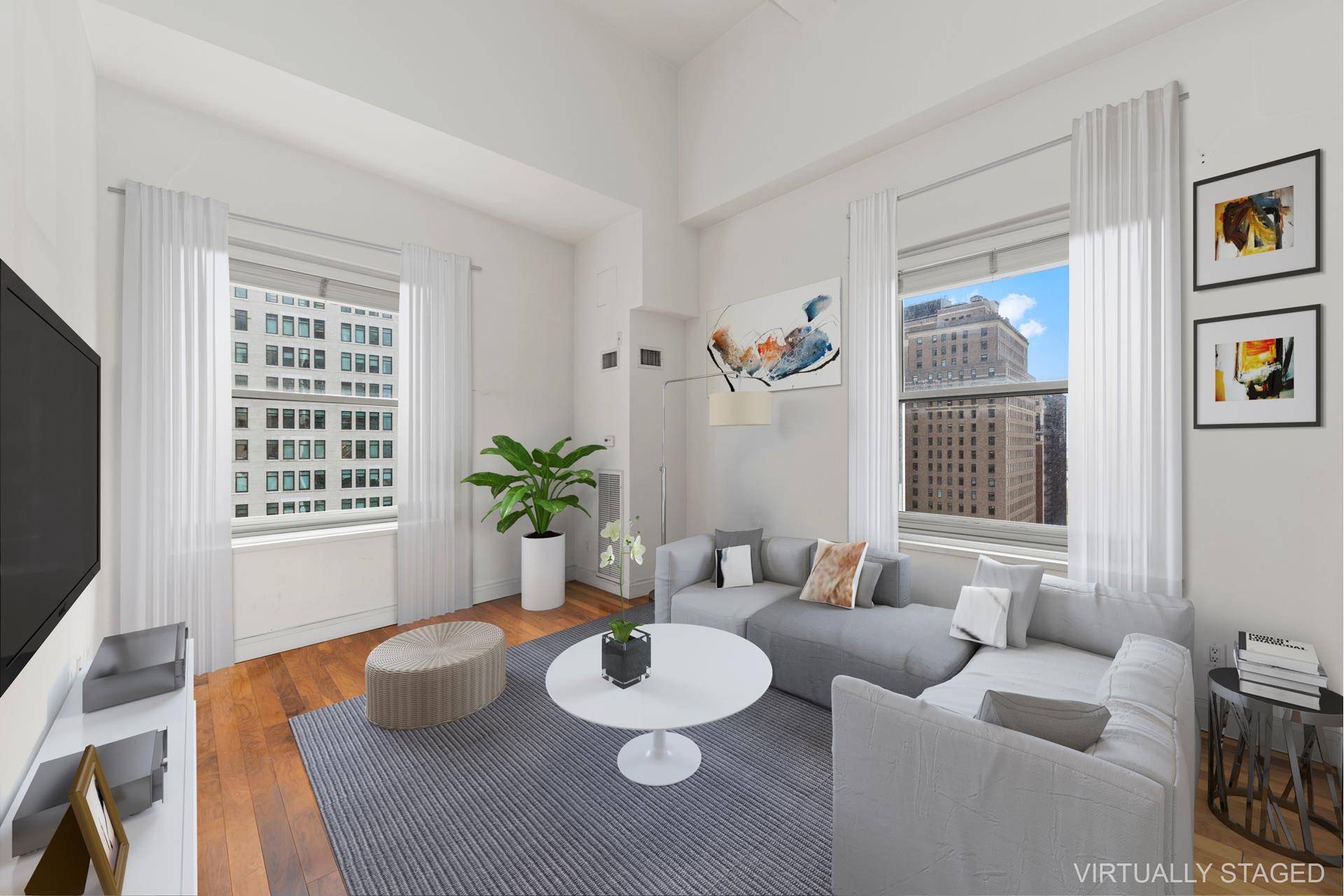 This corner one bedroom apartment with 16' ceilings throughout offers spectacular views of downtown New York and water views from oversized windows.