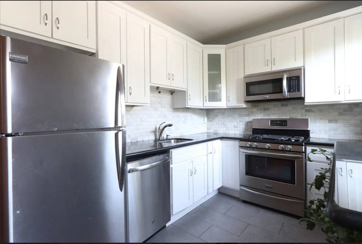 115 1st Place, one of the prettiest and tranquil tree lined N.