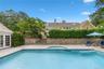 View of pool with a patio, an in-ground hot tub, french doors, and stairs