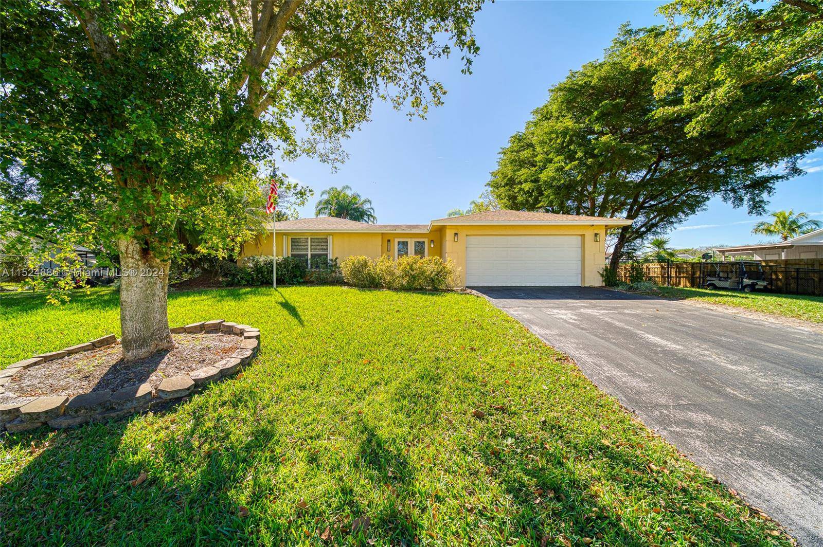 Tastefully Updated 4 bedroom, 2 bathroom home with screened in pool and a 2 car garage located in Palmetto Bay.