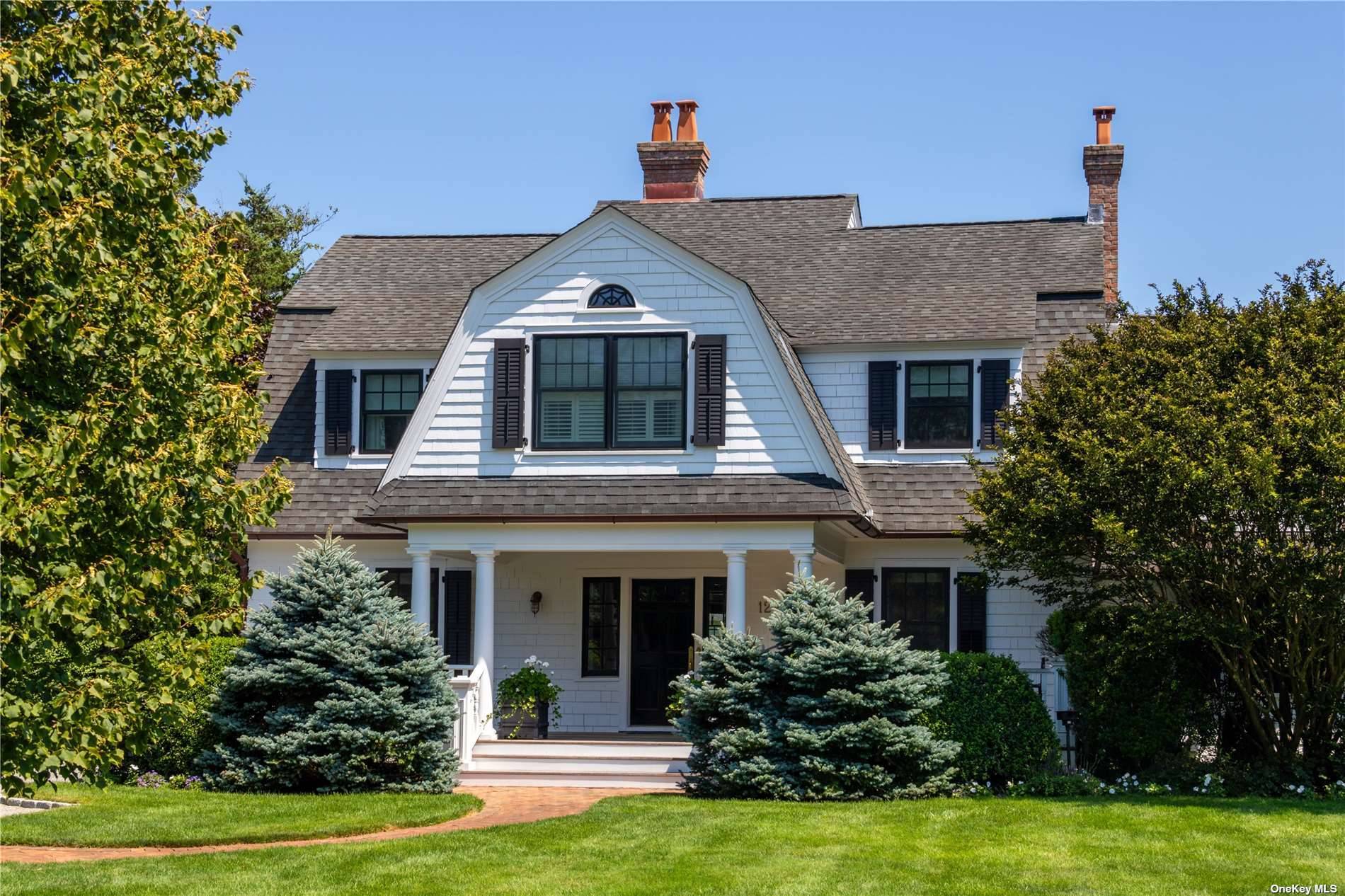 Enjoy a fabulous classic Center Hall Colonial in Quogue Village South, on a quiet lane.