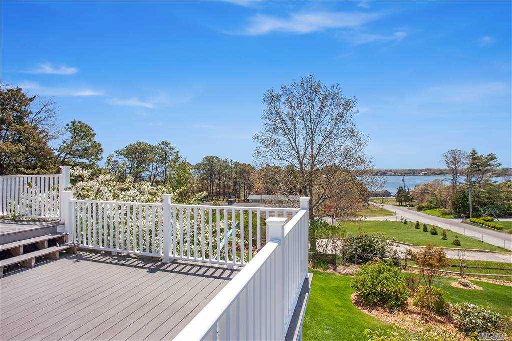 Completely renovated beach cottage with beautiful views overlooking Shinnecock Bay and with private deeded beach !