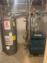 Utilities featuring water heater and a heating unit