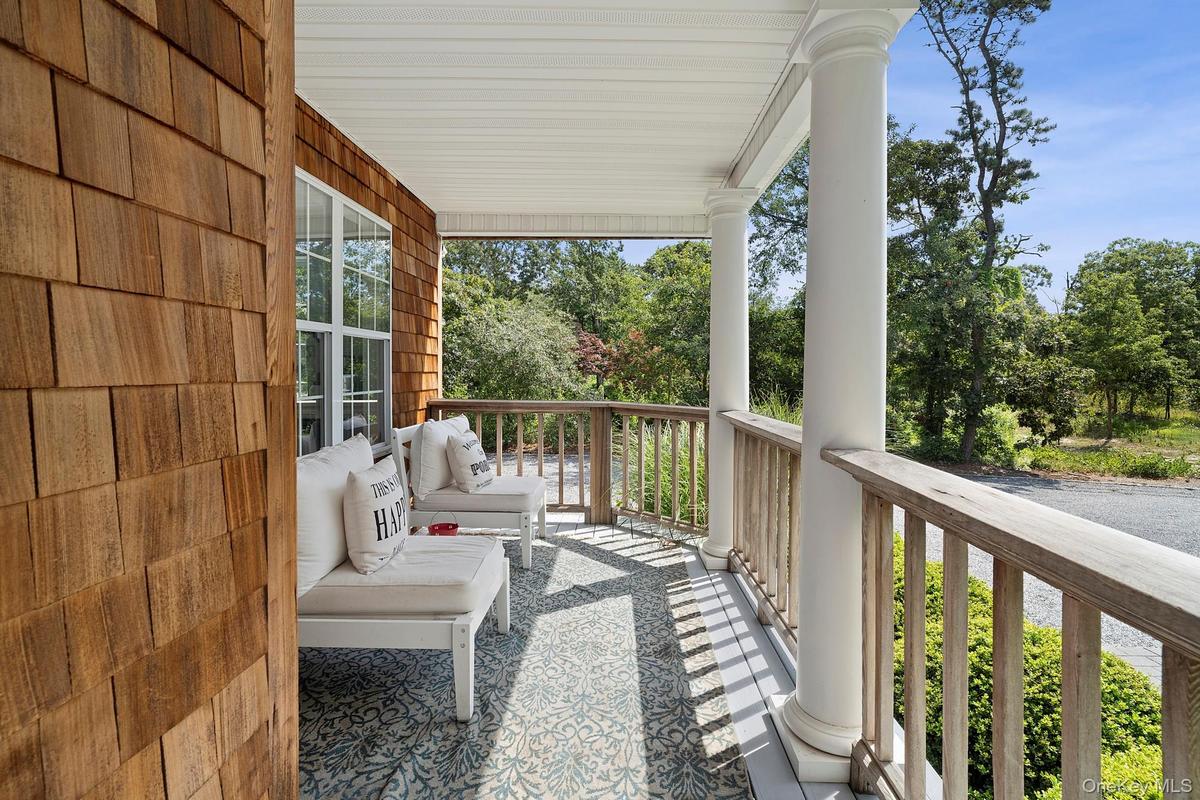 Balcony with view of wooded area