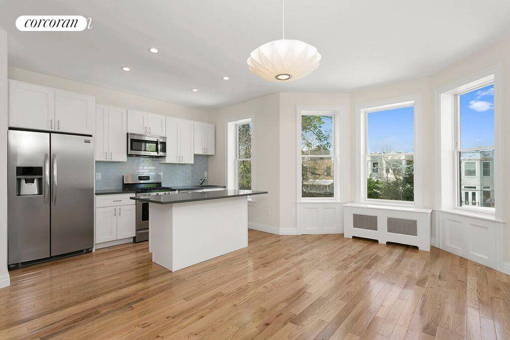 Stunning, renovated 2 bedroom, 2 full bath apartment with a home office on the top floor of a charming 3 story barrel front townhouse at 1207 Carroll St in the ...