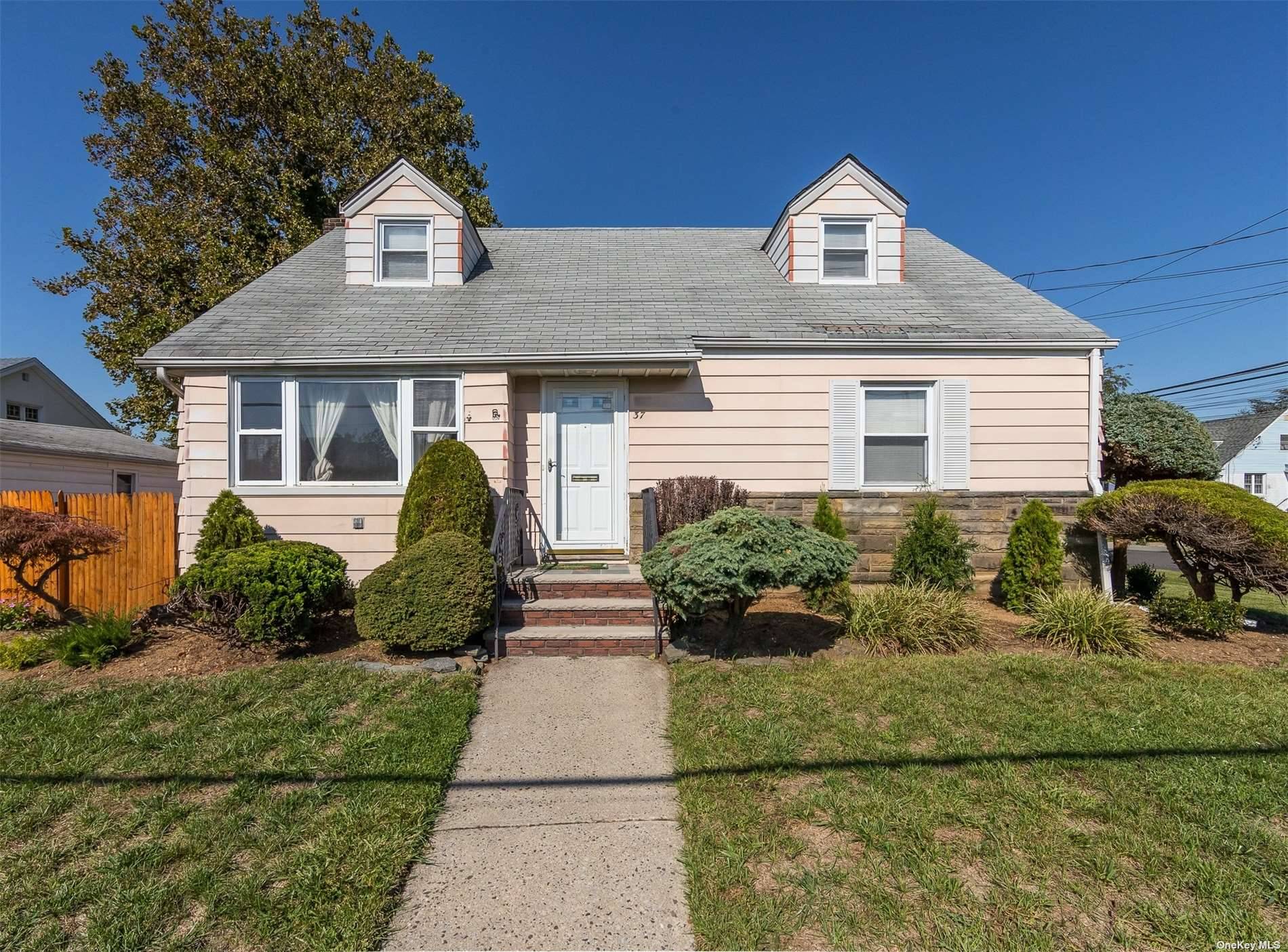 Located in the desirable and charming Village of Malverne, this classic Cape Cod style home with open concept living room and dining room adjoining updated kitchen with new appliances and ...