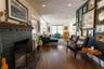 View of fireplace from kitchen