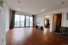 Unfurnished living room featuring dark wood-type flooring