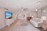 Virtually staged living area with eat in dining area.