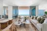 Open living space features a vapor fireplace, opening to the 40 foot terrace