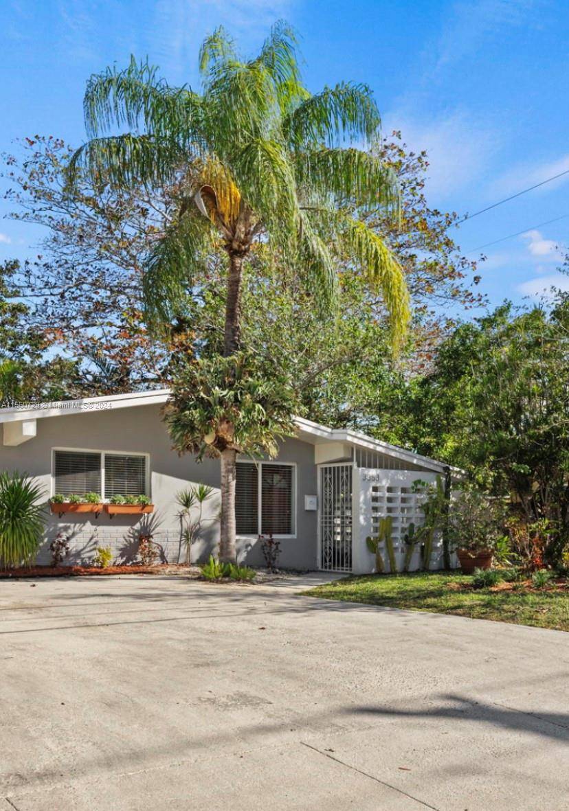 Nestled in the heart of Coconut Grove, this charming house offers a peaceful retreat on a secure street.