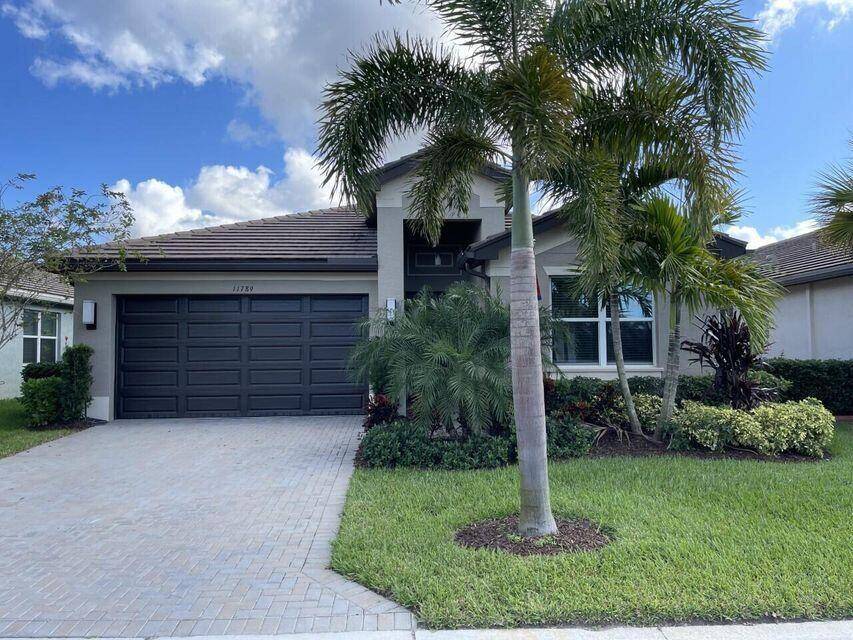 Absolutely beautiful home in the desirable gated 55 Community of Valencia Cay at Riverland.