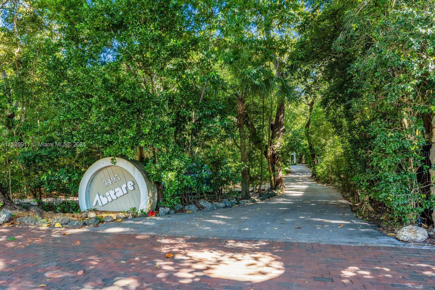Magical townhome in Abitare, an ultra private guard gated community secluded in a natural hardwood hammock on the shores of Biscayne Bay.