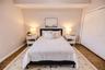 Light filled bedroom with generous storage and easy access to a full bath.