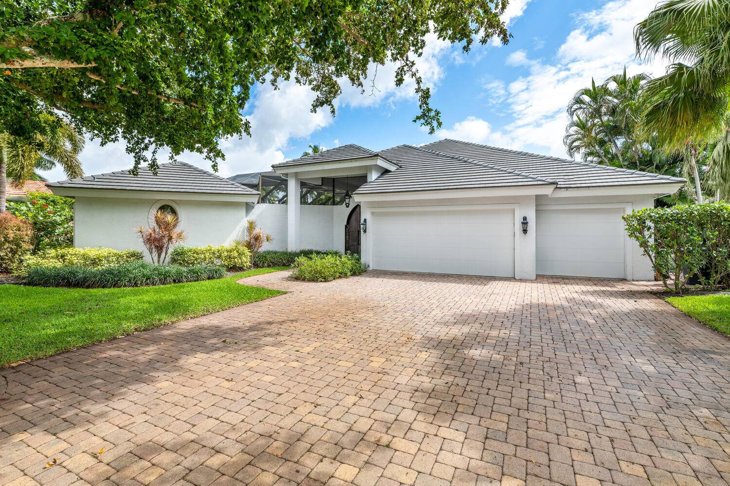 This exquisite waterfront home is located in the private golf community of Palm Beach Polo and offers a sprawling courtyard floorplan with a dramatic sanctuary like pool area.