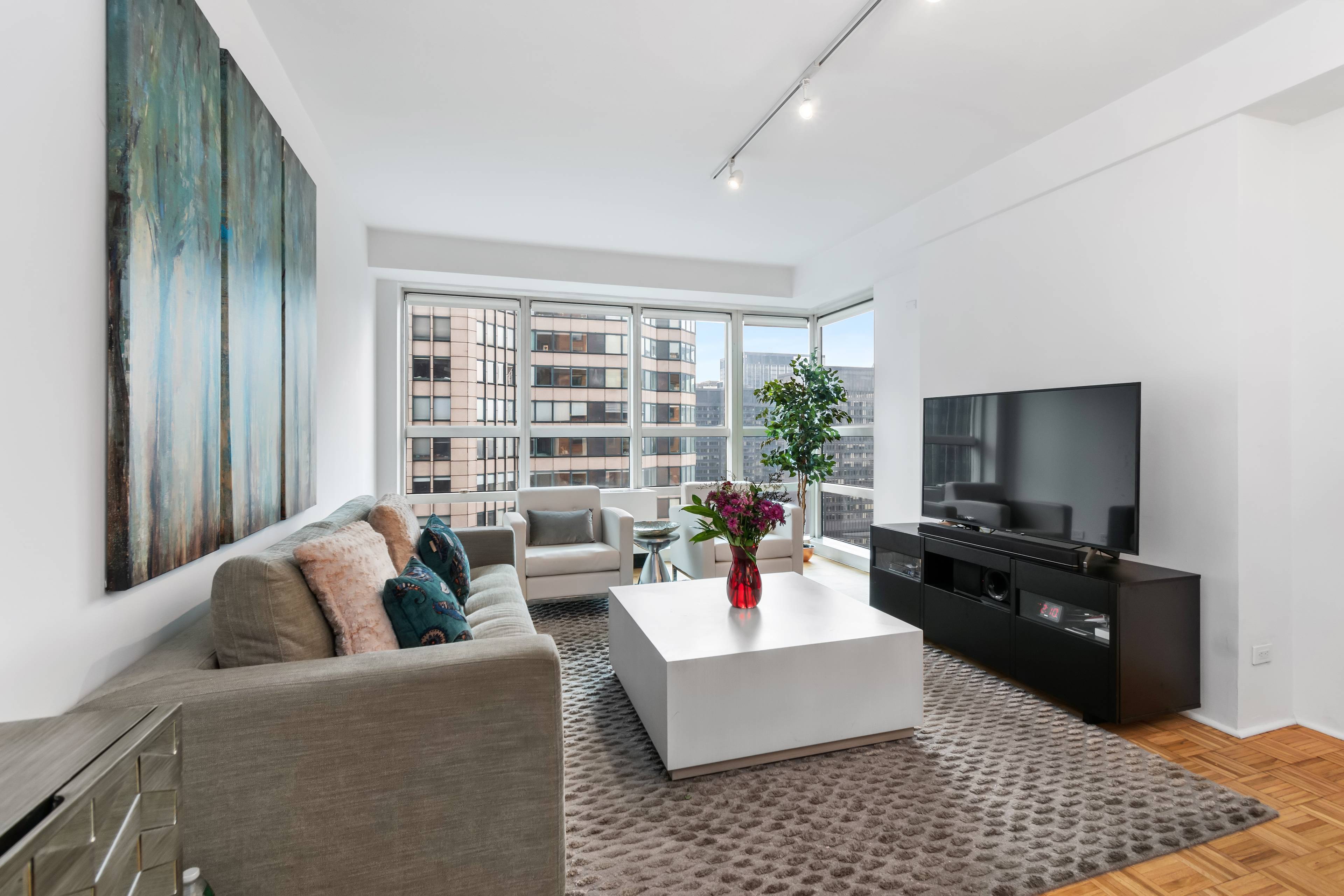 Welcome home to this beautiful corner one bedroom residence, situated on the 53rd floor of one of the most sought after buildings on coveted Billionaire s Row.