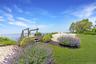 View of grassy yard with a water view