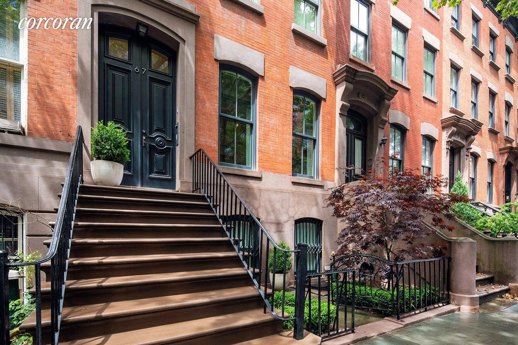 The four story townhouse at 67 Charles is situated on a charming tree lined block in the heart of the original Greenwich Village Historic District.