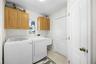 Laudry room with washer, dryer, and wash sink