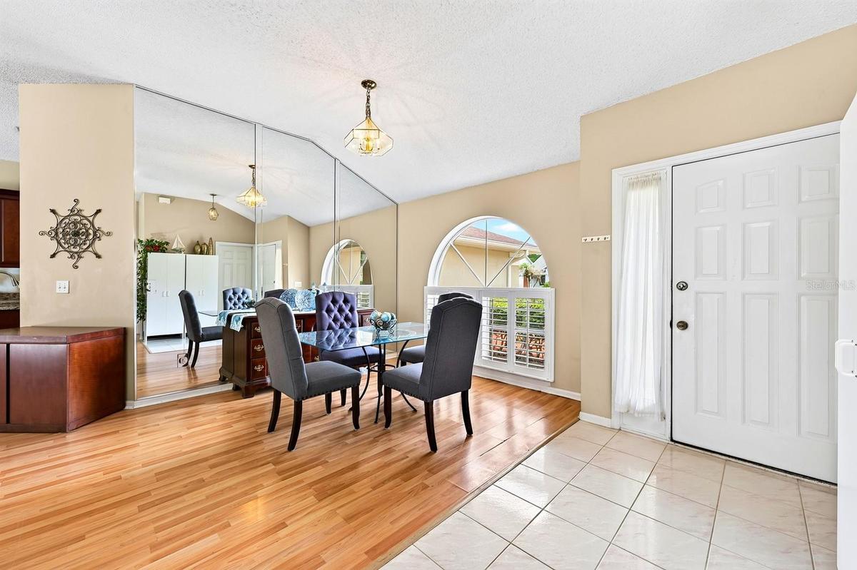 The separate Dining Room is tucked just off the foyer and features a CHARMING ARCHED front-facing window.