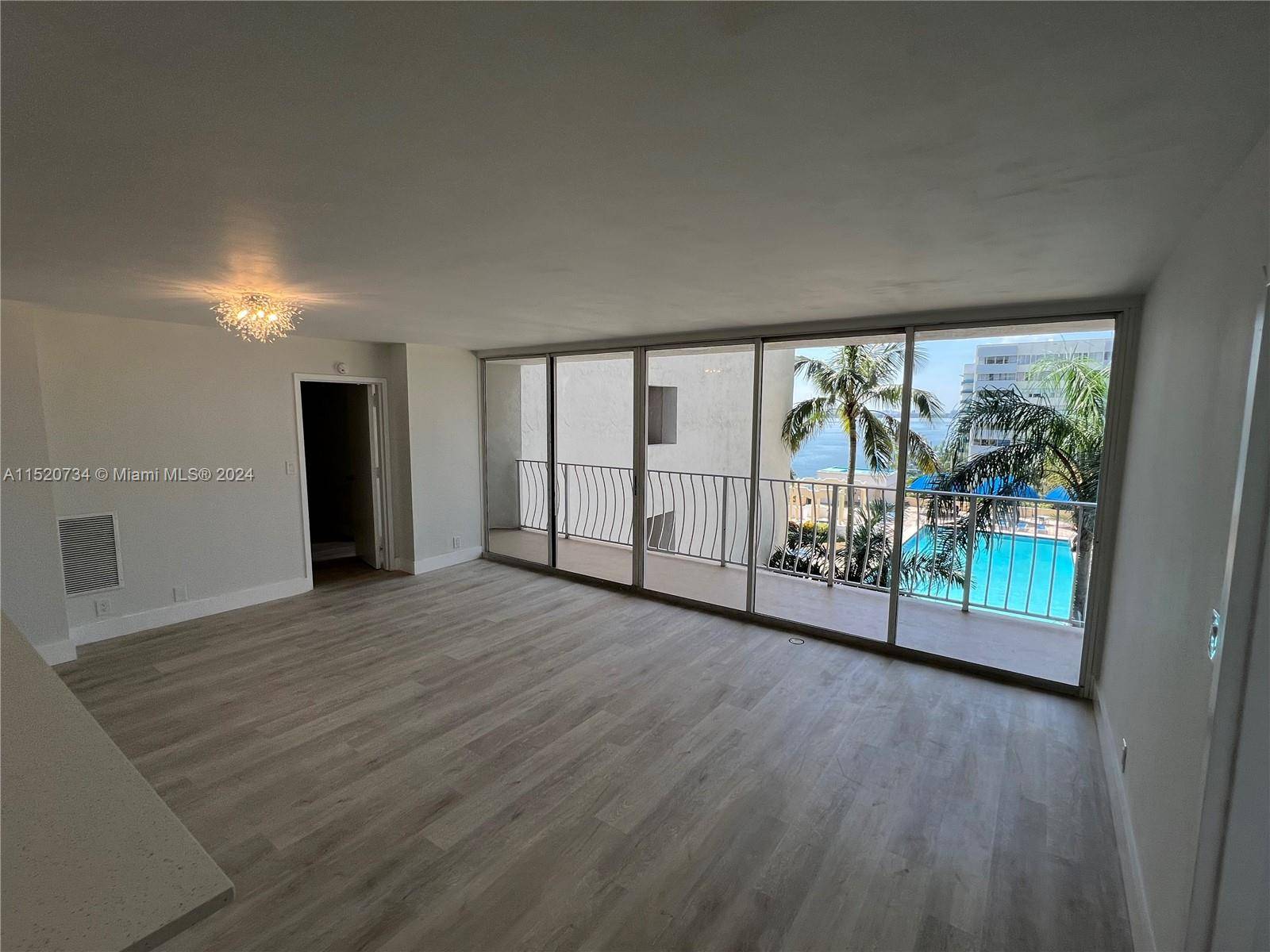 Beautifully remodeled 2bed 2bath unit with water views overlooking renovated swimming pool tropical terrace area.