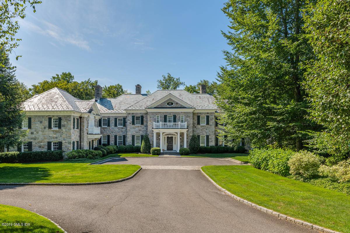 RARE PRIVACY AND SECLUSION WITH 24 HOUR MANNED SECURITY, RED PAVED ROADS, WHITE RAIL FENCES, MANICURED LAWNS AND STATELY TREES IN THE EXCLUSIVE AND GATED ENCLAVE OF CONYERS FARM LOCATED ...