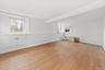 Grand open, bright and spacious living room with new luxury vinyl flooring and freshly painted.