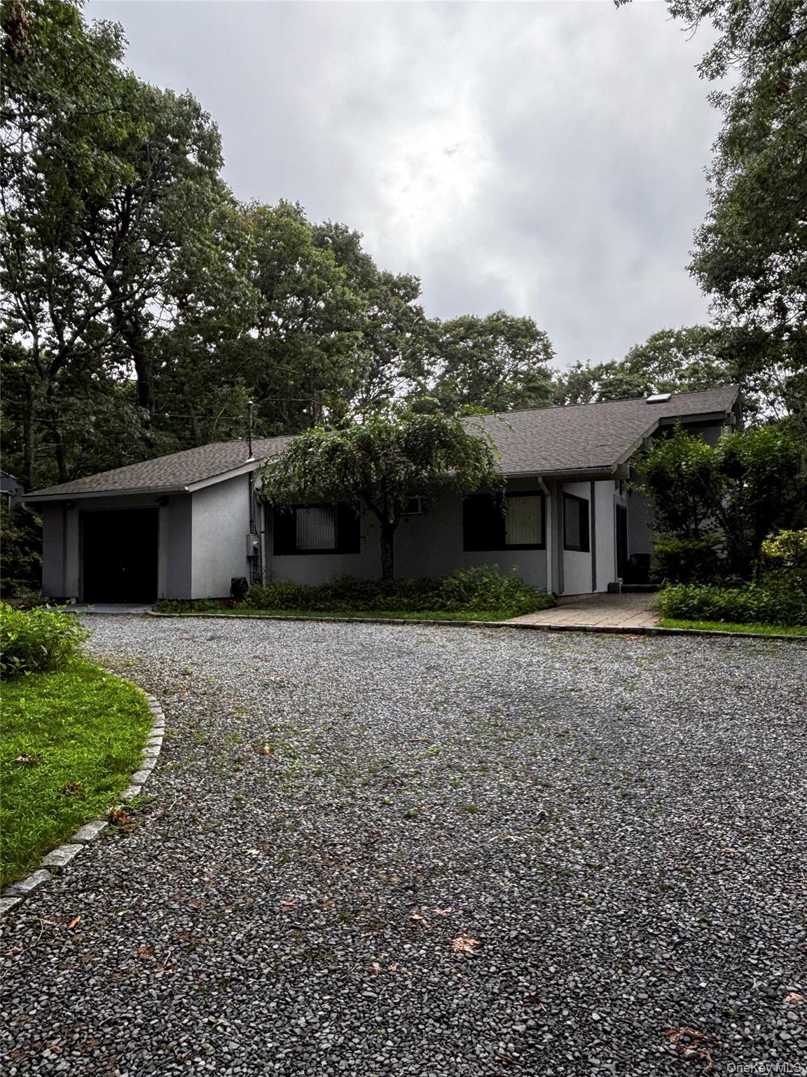 Modern single-story residence featuring a clean architectural design with Stucco facade