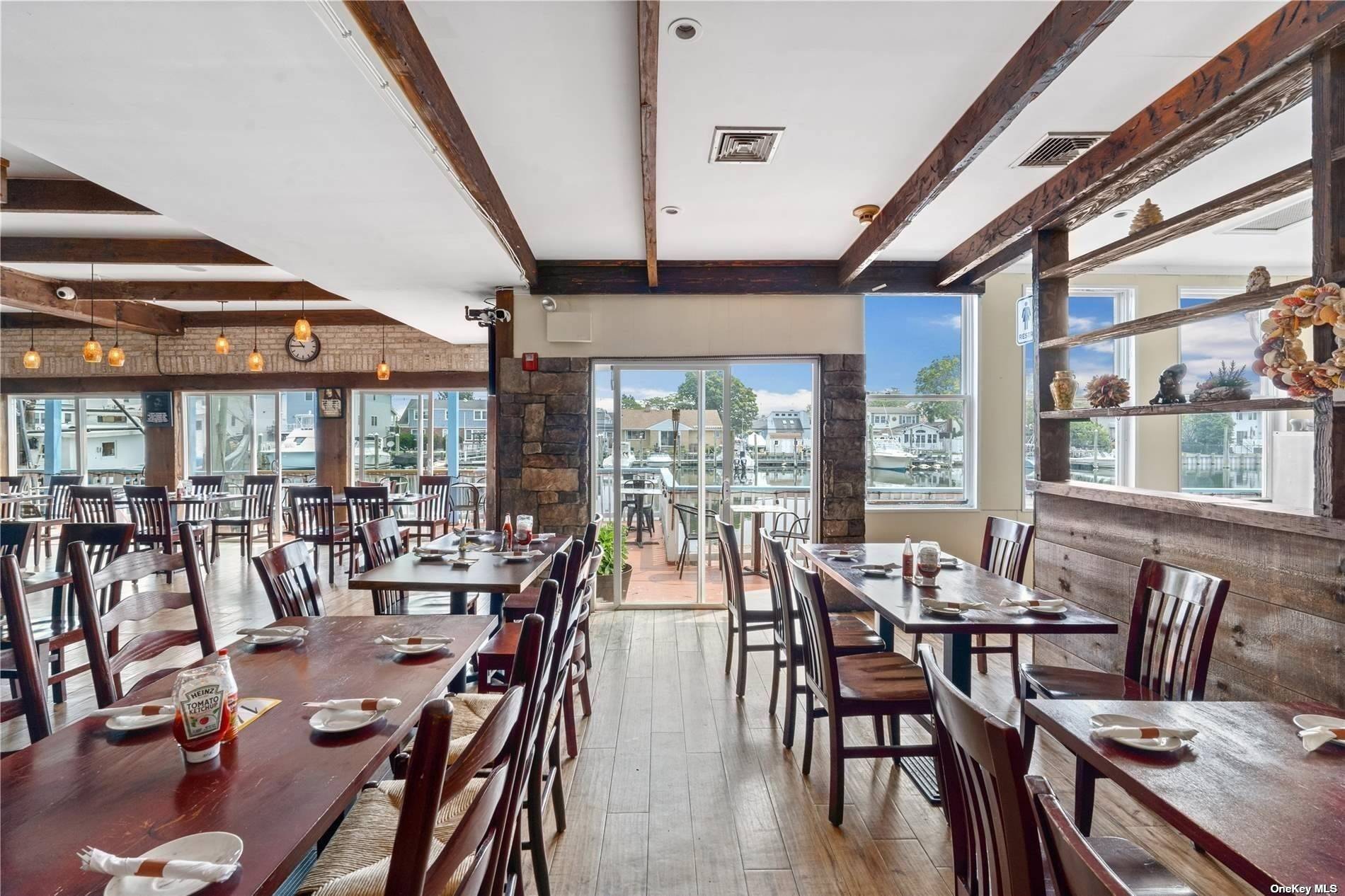 Discover a rare opportunity to own a coveted waterfront restaurant property that epitomizes coastal charm in the heart of The Nautical Mile in Freeport, a destination restaurant, where patrons dine ...