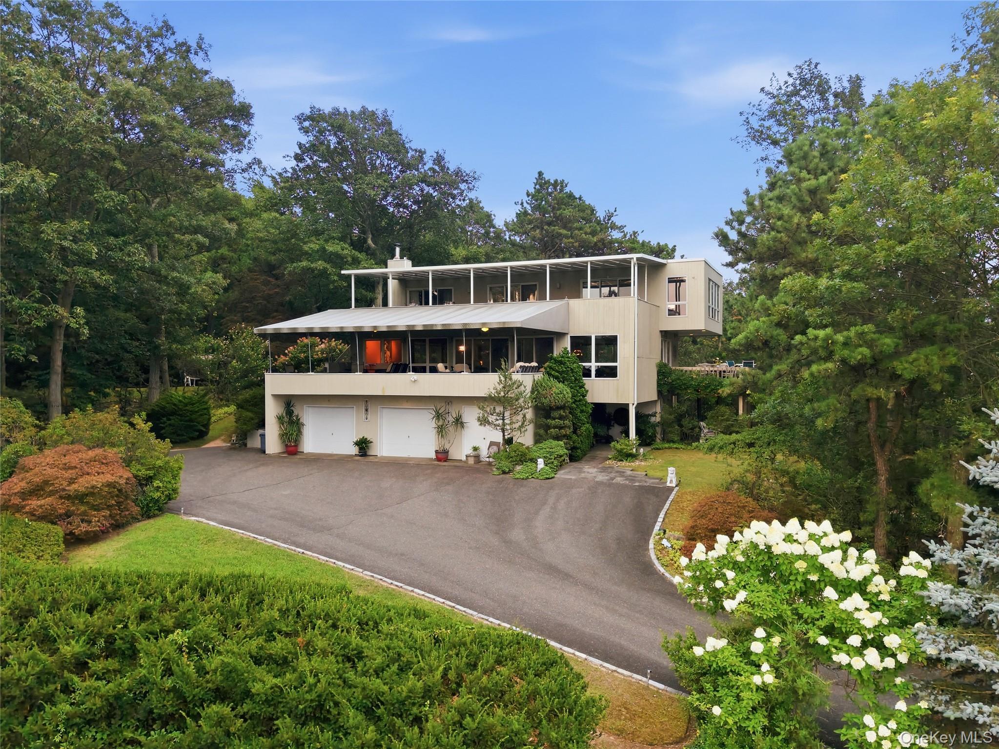 Front of home, 2 balconies, 2.5car garage, expansive driveway