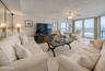 The living area features full-length windows with unobstructed ocean views and access to the balcony an ideal setting for relaxing or hosting guests.