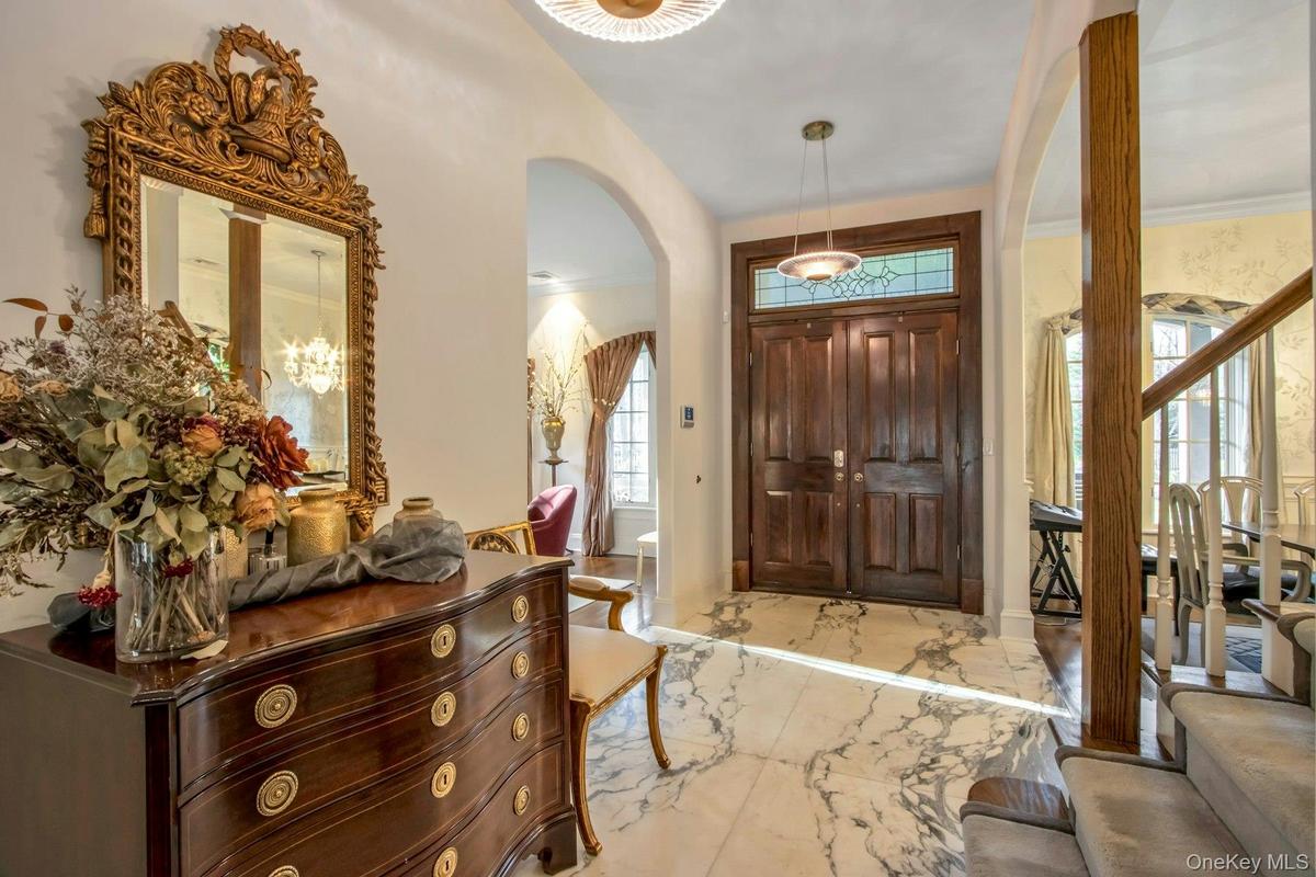 Foyer entrance featuring ornamental molding