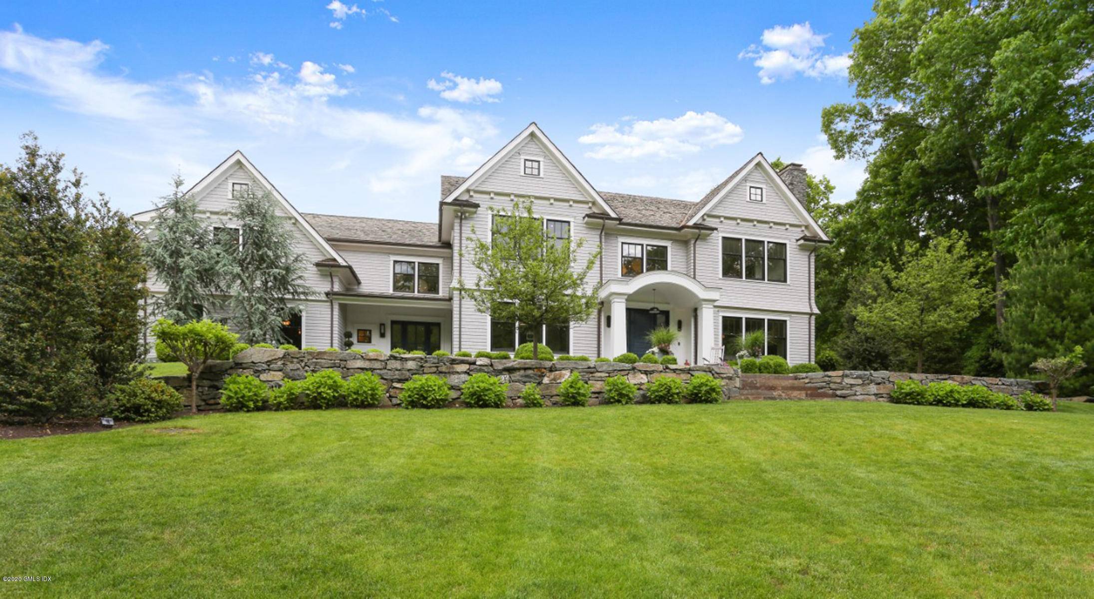 Custom built shingle style residence with a refreshing new take close to schools and town.