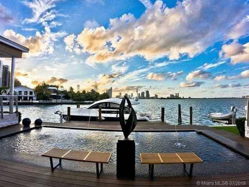 Stunning contemporary waterfront estate with gated entry on Venetian Island.