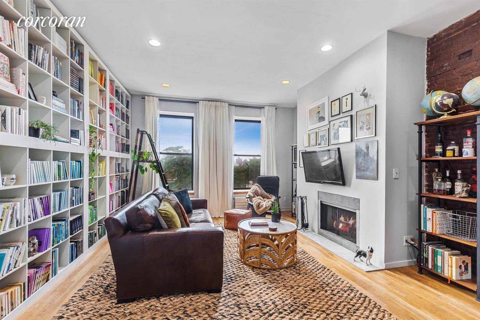 This spacious loft like two bedroom, one bath apartment will charm you with its grand proportions, excellent light, and Empire State building view through oversized west facing windows.