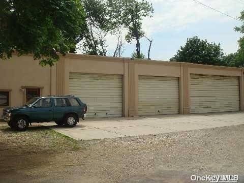 One Double Garage Space lNote 3rd Door on the right as pictured w storage, 1 office space and 1.